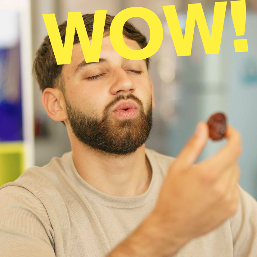young man eats a fresh date